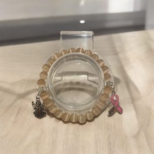 Champange färg med rosa bandet