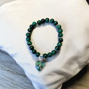 Grön cateye med livets träd